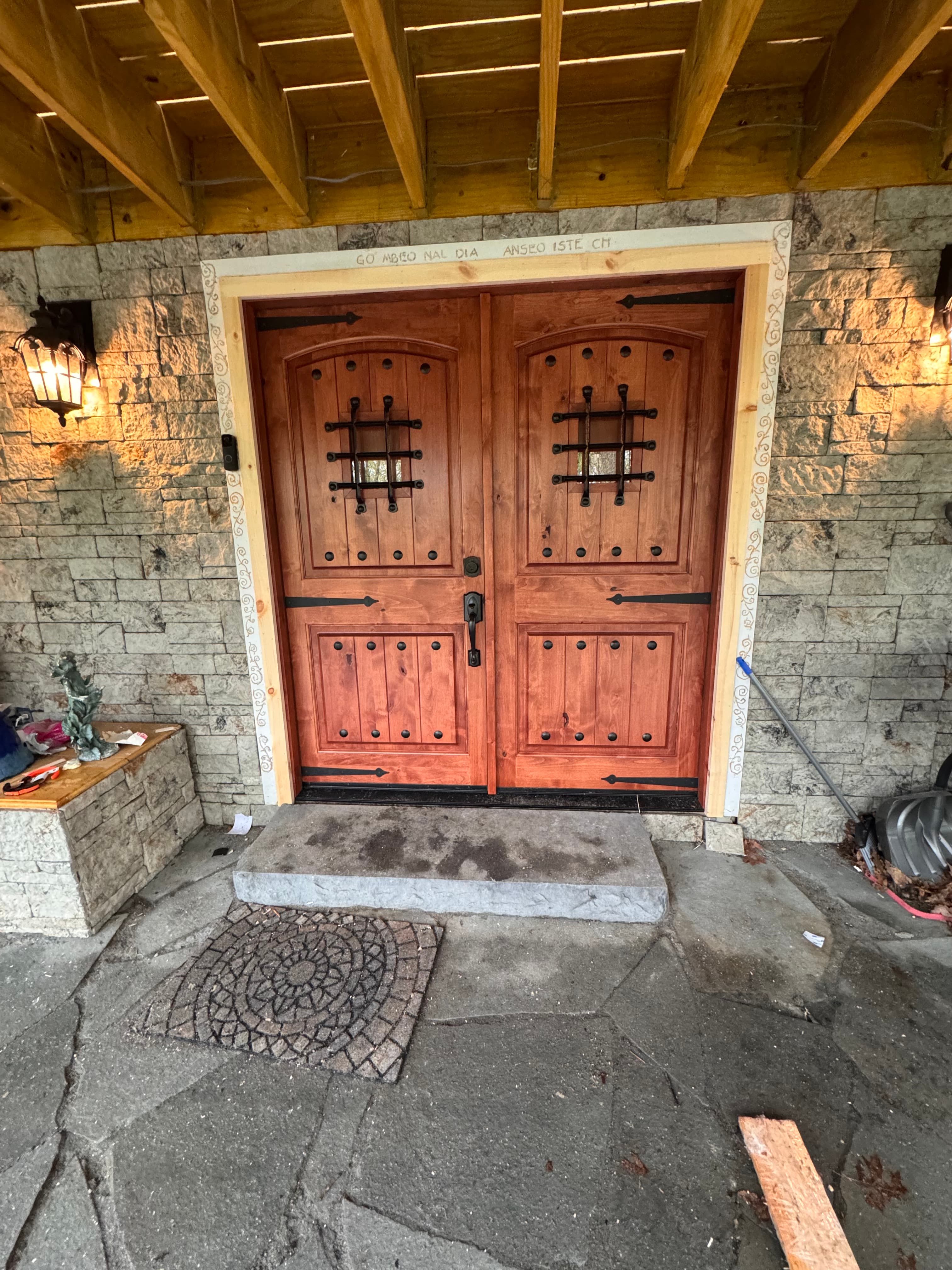 Rustic wood double doors with iron strap hinges