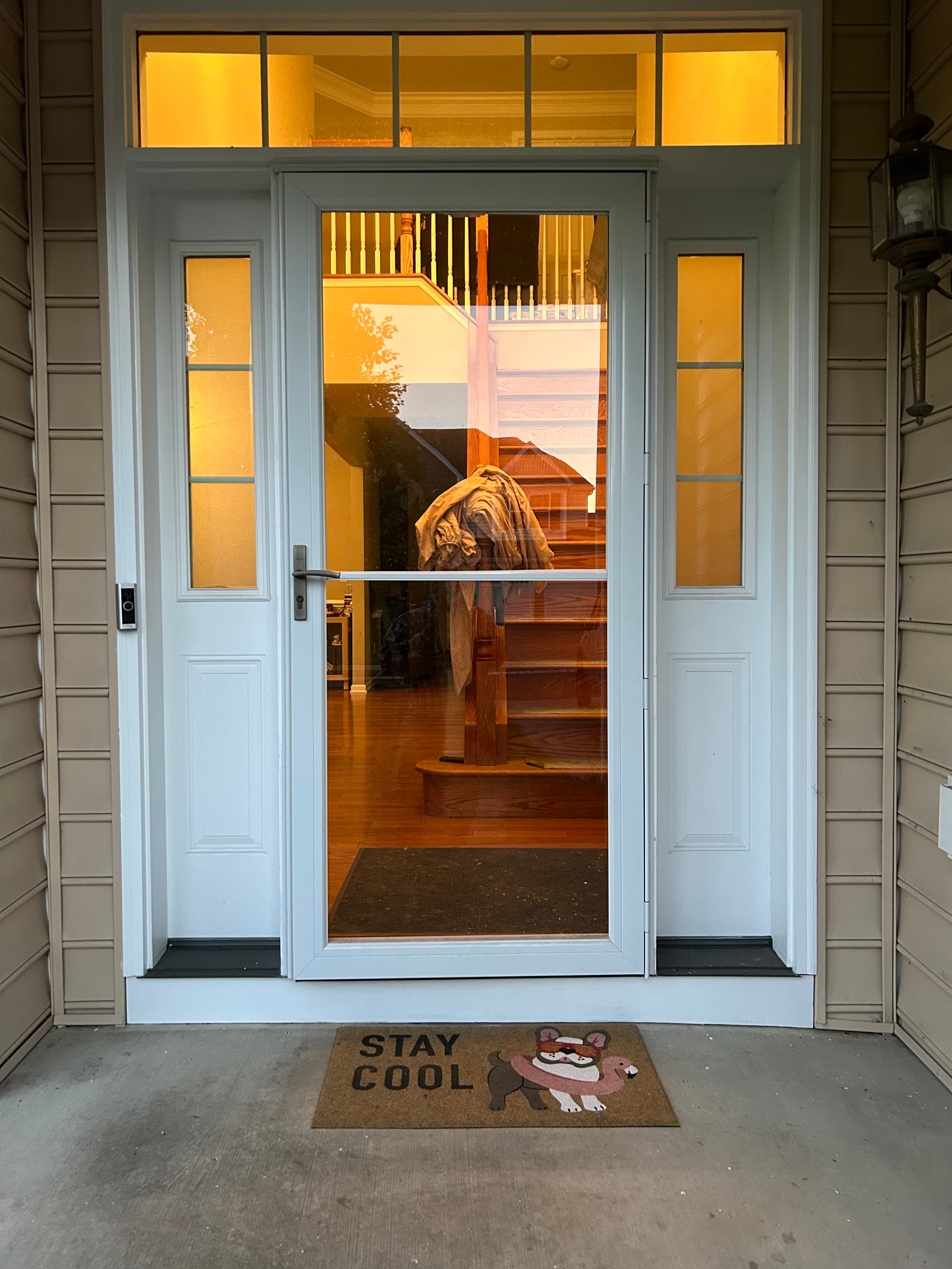 White entry door with full-glass center and sidelights